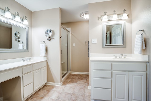 bathroom with vanity, an enclosed shower, and tile patterned flooring