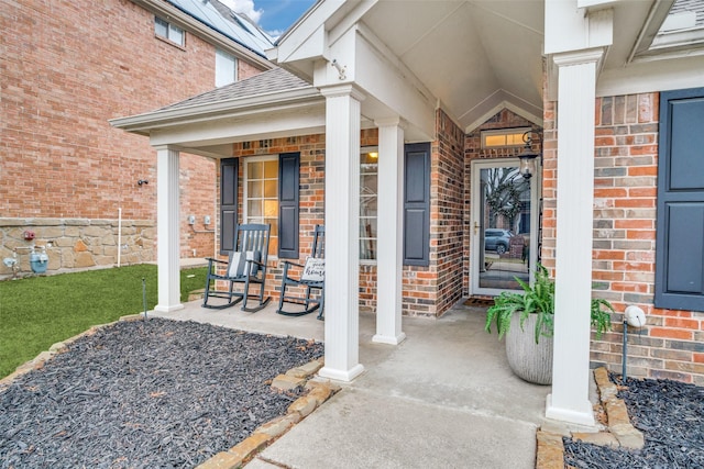 property entrance featuring covered porch