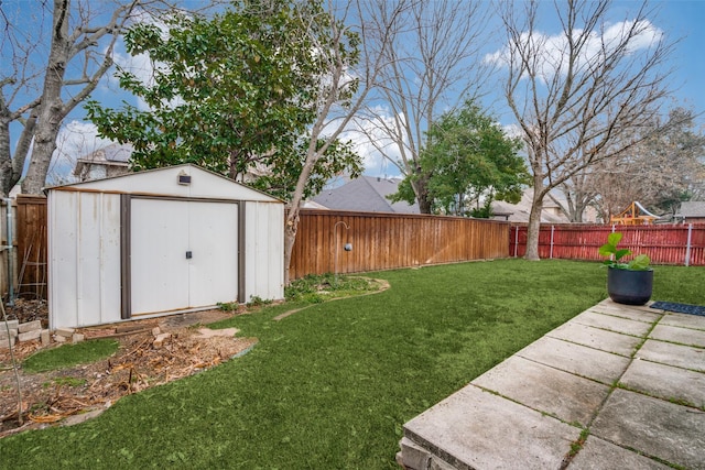 view of yard with a patio area and a storage shed