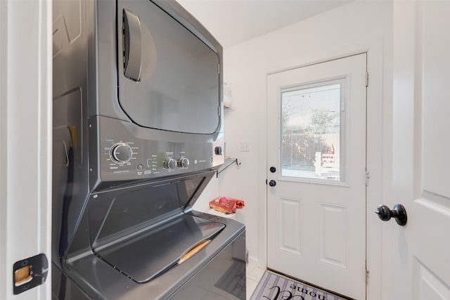 laundry room featuring stacked washer and dryer