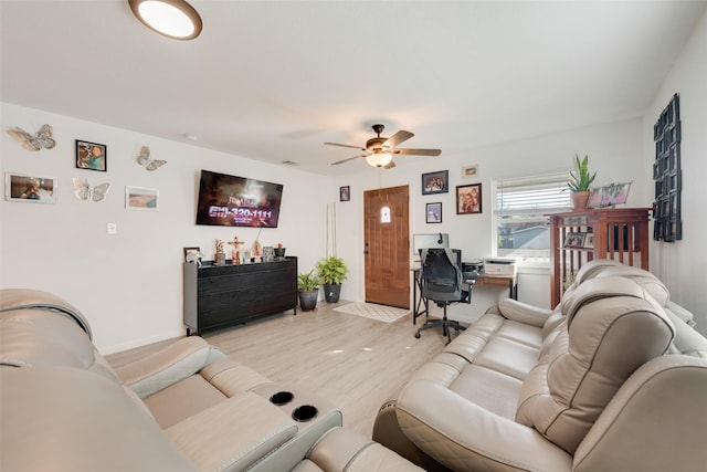 living room featuring ceiling fan and light wood-type flooring