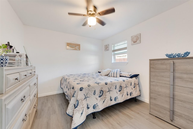 bedroom featuring light hardwood / wood-style flooring and ceiling fan