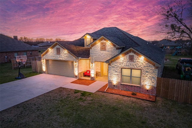 view of front of home featuring a garage, a playground, and a lawn