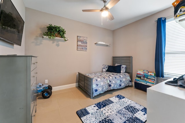 bedroom with light tile patterned floors and ceiling fan