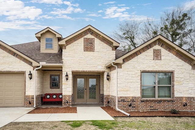 view of front facade with french doors and a garage