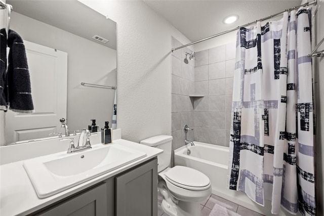 full bathroom featuring vanity, toilet, and shower / bath combo with shower curtain