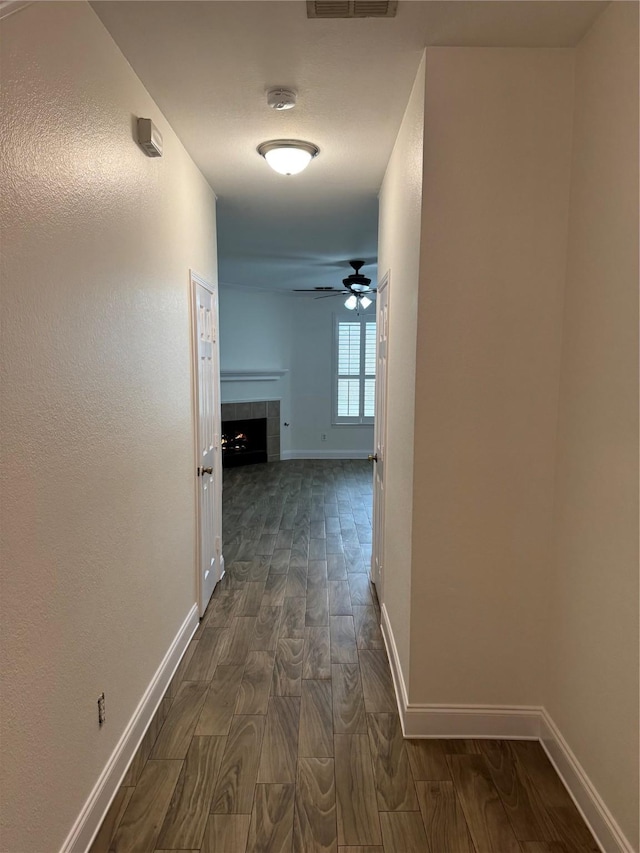 corridor with dark wood-type flooring