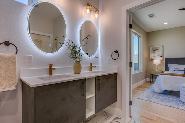 bathroom featuring hardwood / wood-style flooring and vanity