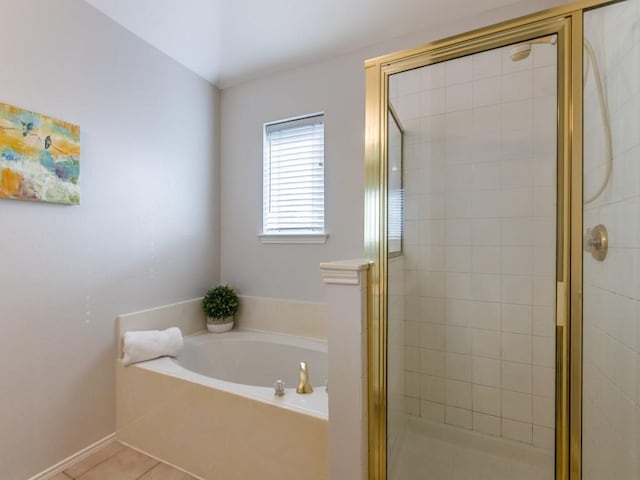 bathroom with tile patterned floors and independent shower and bath