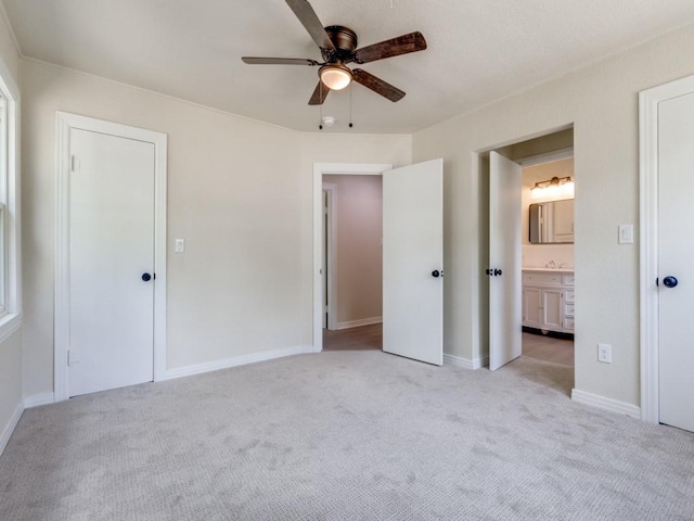 carpeted empty room featuring ceiling fan, a healthy amount of sunlight, and a textured ceiling