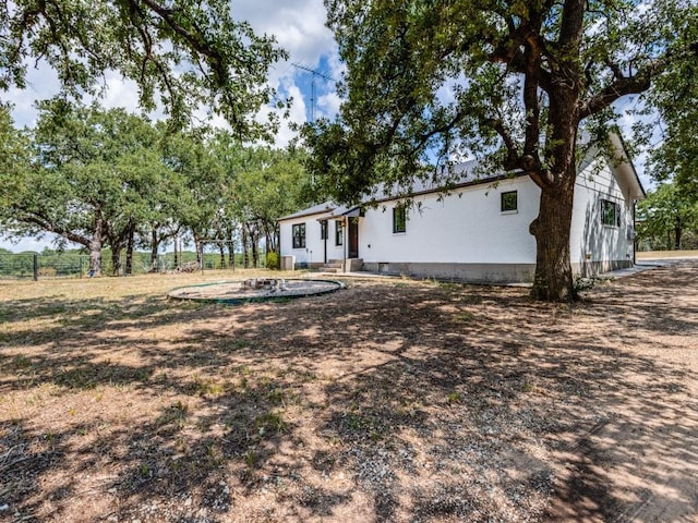 view of yard with an outbuilding and an outdoor fire pit