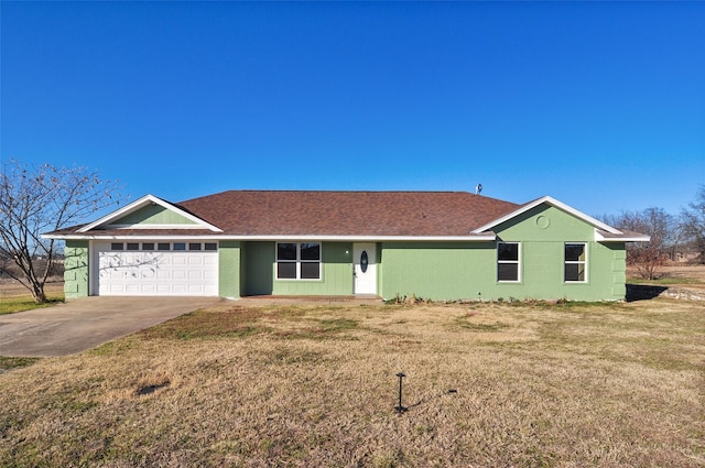 ranch-style home featuring a garage and a front lawn