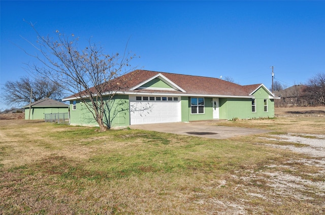 ranch-style house featuring a garage and a front yard