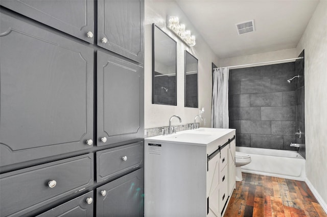 full bathroom with shower / bath combination with curtain, vanity, toilet, and hardwood / wood-style flooring