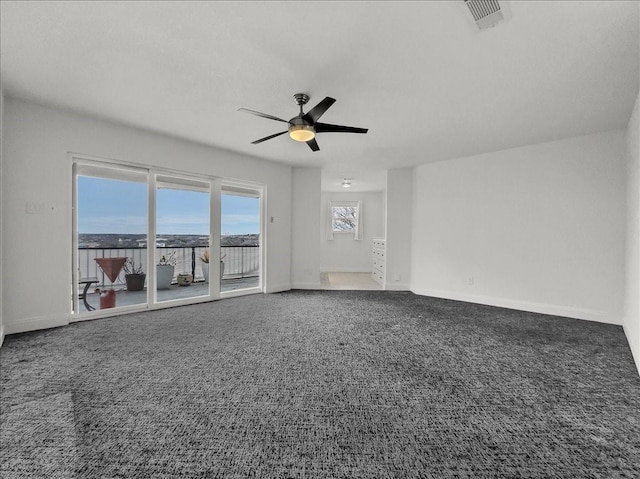 unfurnished living room featuring carpet floors and ceiling fan