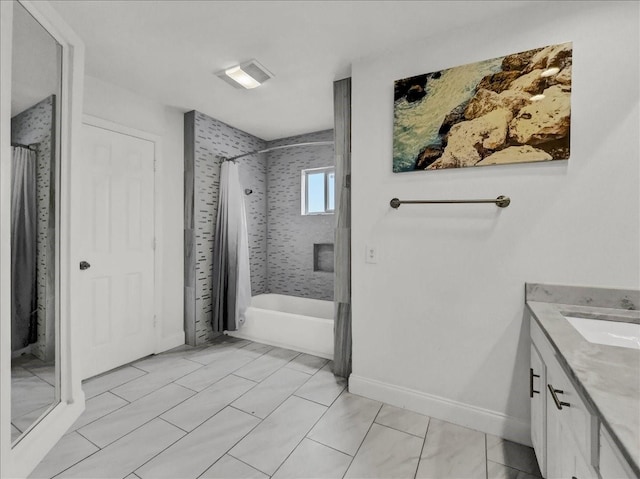 bathroom featuring vanity and shower / bath combo