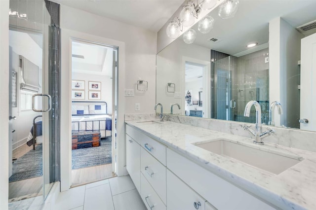 bathroom with tile patterned floors and vanity