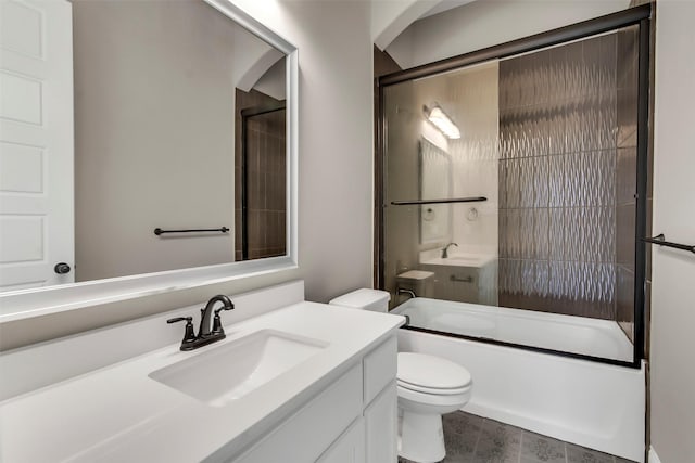 full bathroom featuring vanity, toilet, and combined bath / shower with glass door