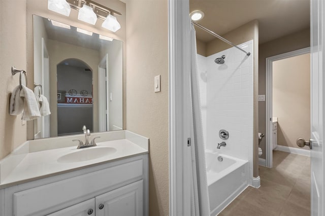 full bathroom with toilet, vanity, baseboards, shower / bathing tub combination, and tile patterned floors