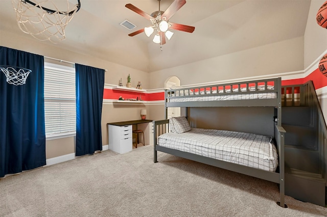 unfurnished bedroom with a ceiling fan, visible vents, vaulted ceiling, baseboards, and carpet