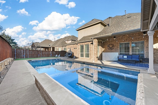 view of swimming pool with a fenced in pool, a fenced backyard, a patio, and an outdoor hangout area