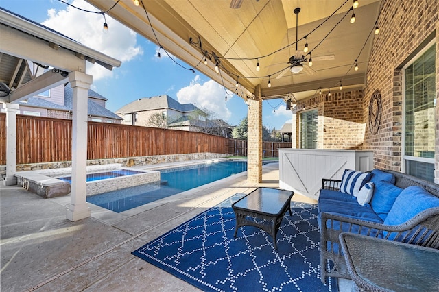 view of patio / terrace featuring an outdoor hangout area, a pool with connected hot tub, a fenced backyard, and a ceiling fan