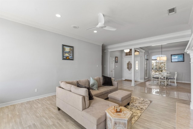 living room with crown molding, ceiling fan, and light hardwood / wood-style floors