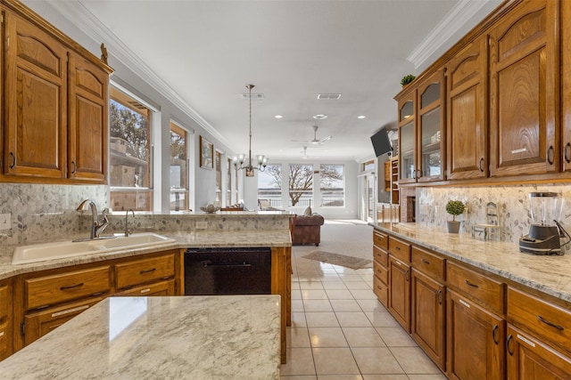 kitchen with pendant lighting, sink, light tile patterned floors, black dishwasher, and ornamental molding