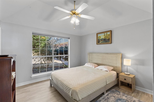 bedroom with ceiling fan and light wood-type flooring