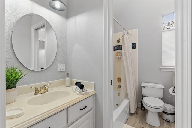 full bathroom with hardwood / wood-style flooring, vanity, toilet, and shower / bath combo with shower curtain