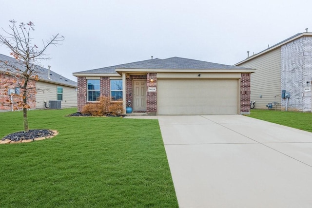 single story home featuring a garage, a front yard, and central air condition unit