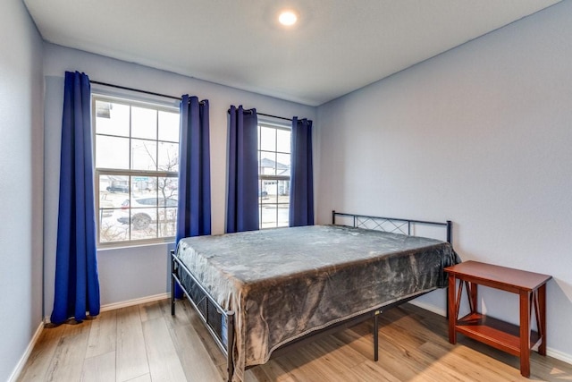 bedroom featuring wood-type flooring