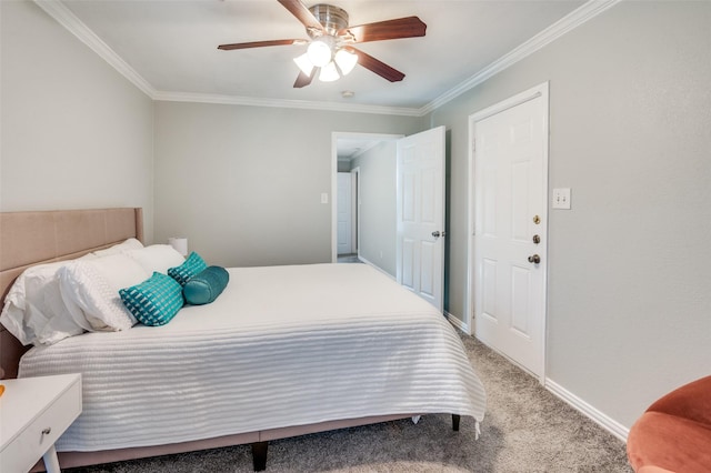 carpeted bedroom with ceiling fan and ornamental molding