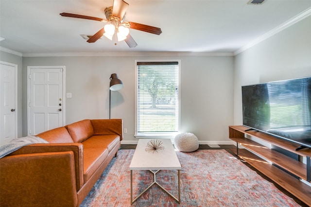 living room with crown molding, ceiling fan, and light hardwood / wood-style flooring