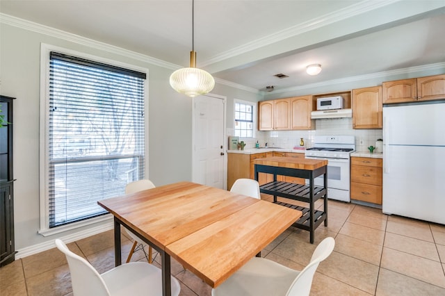 tiled dining area with crown molding