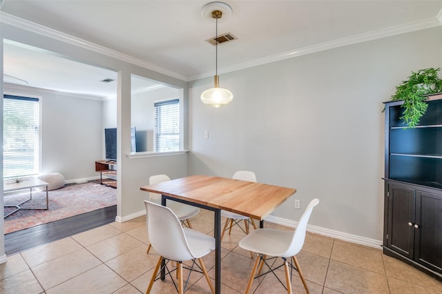 tiled dining area with crown molding