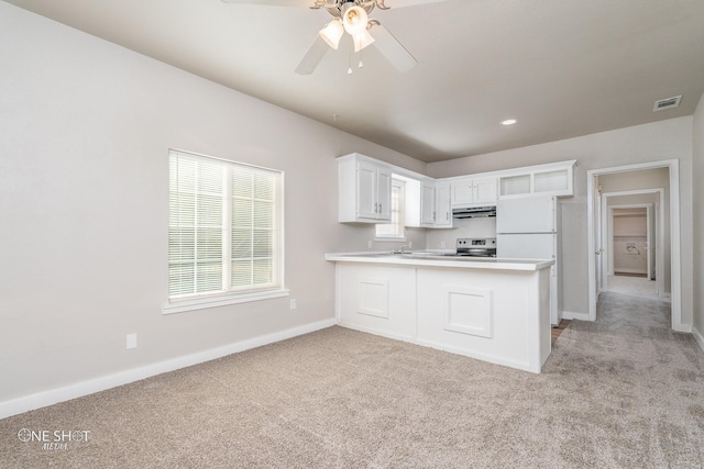 kitchen with stainless steel electric stove, white cabinetry, ceiling fan, kitchen peninsula, and light carpet