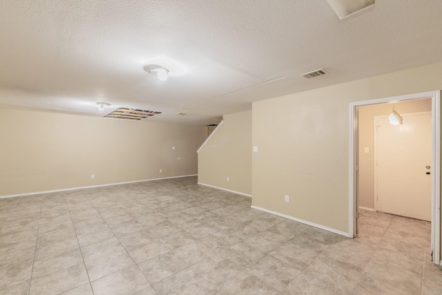 basement with a textured ceiling