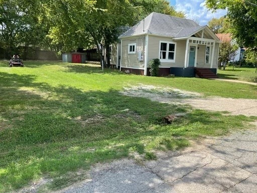 exterior space featuring a storage shed