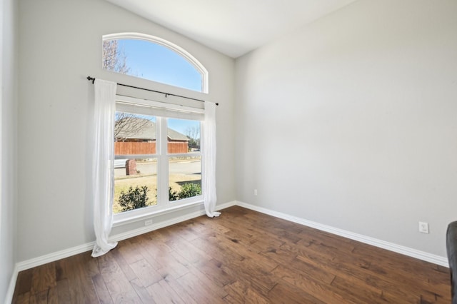 empty room featuring dark wood-type flooring