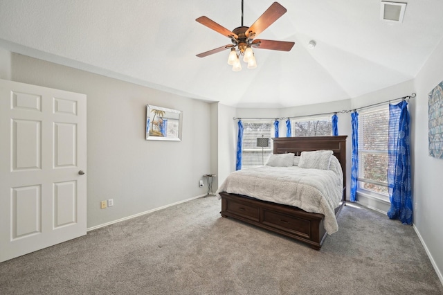 carpeted bedroom with ceiling fan and lofted ceiling