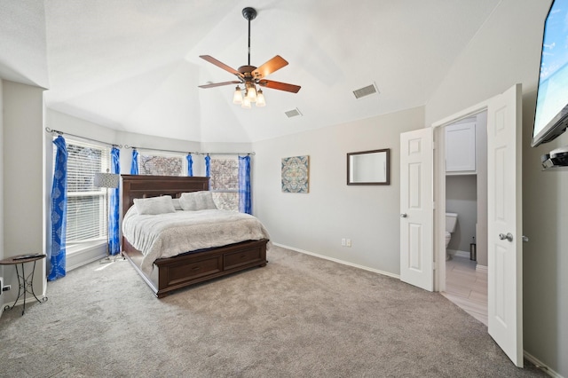 carpeted bedroom featuring multiple windows, vaulted ceiling, and ceiling fan