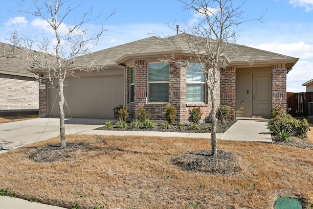 ranch-style house with a garage and a front lawn