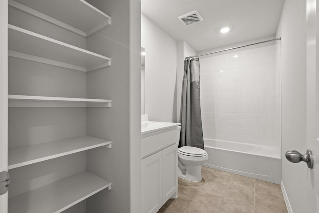 full bathroom featuring shower / bath combination with curtain, vanity, toilet, and tile patterned flooring