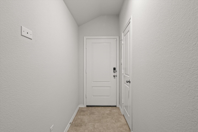 hallway featuring lofted ceiling