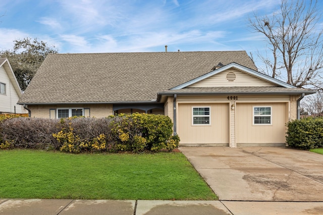 view of front facade with a garage and a front yard