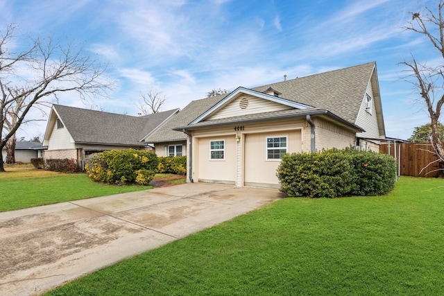 view of front of property with a garage and a front yard