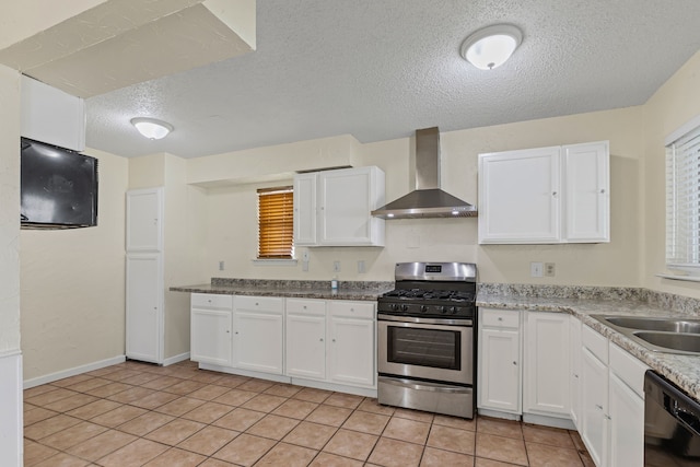 kitchen featuring wall chimney range hood, black dishwasher, stainless steel range with gas stovetop, and white cabinets