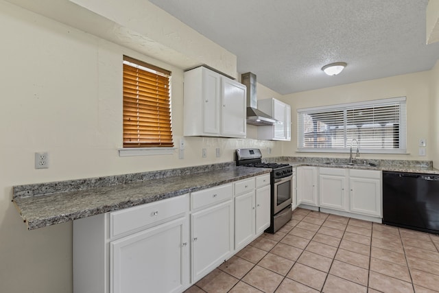 kitchen featuring sink, stainless steel gas stove, white cabinetry, dishwasher, and wall chimney range hood