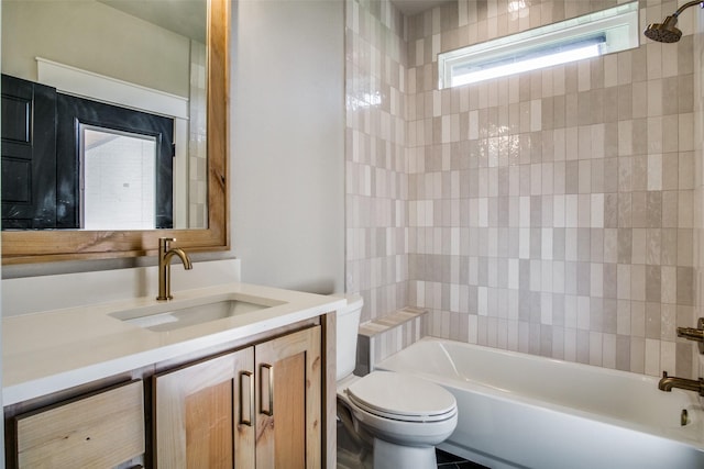 full bathroom with tiled shower / bath combo, vanity, and toilet